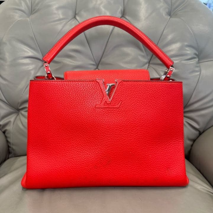 Louis Vuitton Capucines, Red, condition grade A